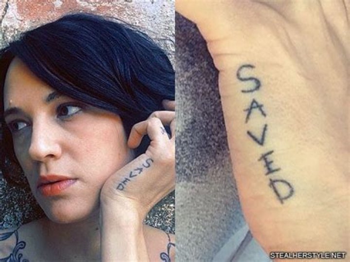 Asia Argento's 22 Tattoos & Meanings
