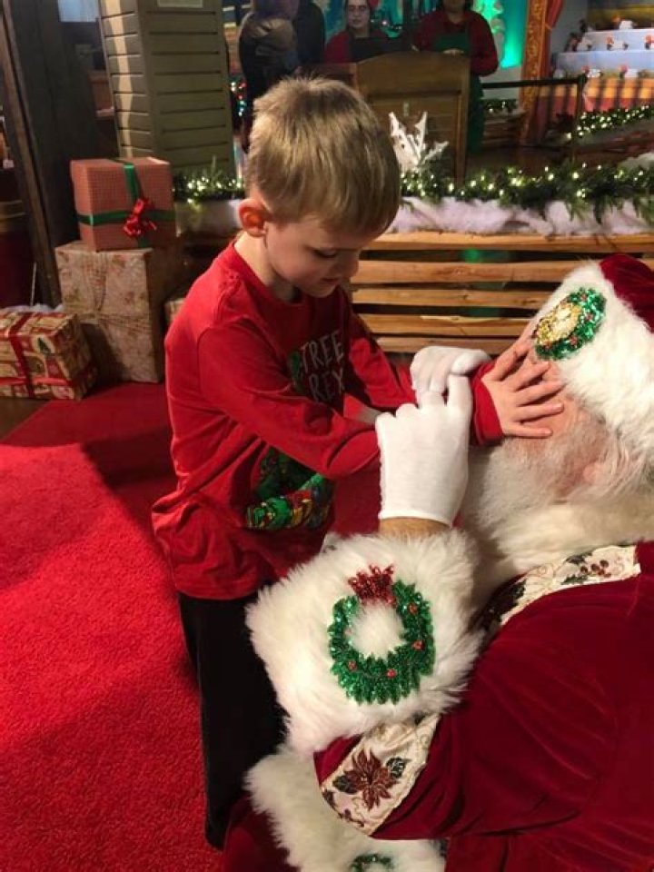 Boy who is blind, with autism, meets Santa; photos go viral