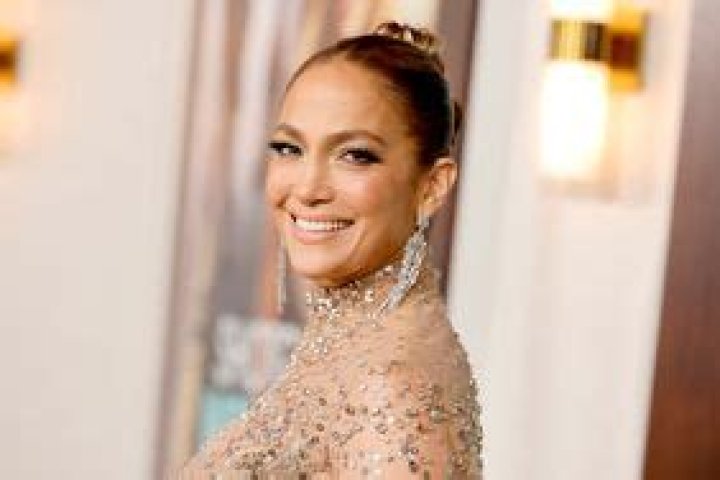 Jennifer Lopez Paired a Lacy, Barbiecore-Approved Bra With Nothing But a Silky Pink Robe