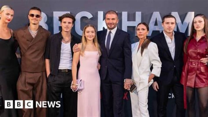 The Beckhams are here — and David stopped to hug a fan