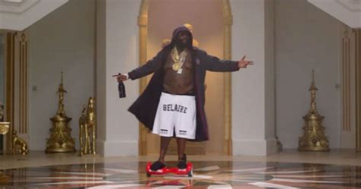 Watch a Shirtless Rick Ross Spin Around on a Hoverboard With His Ankle Monitor On